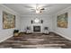 Spacious living room with hardwood floors and a fireplace at 341 Harts Creek Dr Dr, Pittsboro, NC 27312