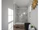 Large walk-in shower with marble-look tile at 341 Harts Creek Dr Dr, Pittsboro, NC 27312