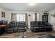 Finished basement with two reclining sofas and large windows at 386 Cotton Brook Dr, Fuquay Varina, NC 27526