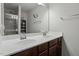 Double vanity bathroom with a large mirror and shower at 386 Cotton Brook Dr, Fuquay Varina, NC 27526