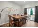 Bright dining area with wooden table and chairs, access to deck at 386 Cotton Brook Dr, Fuquay Varina, NC 27526