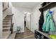 An entryway with staircase, coat rack, and shoe storage at 386 Cotton Brook Dr, Fuquay Varina, NC 27526