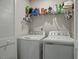Laundry room with washer, dryer, and shelving at 386 Cotton Brook Dr, Fuquay Varina, NC 27526