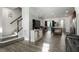 Spacious living room with hardwood floors and large windows at 386 Cotton Brook Dr, Fuquay Varina, NC 27526