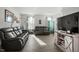 Living room featuring two reclining sofas and a media console at 386 Cotton Brook Dr, Fuquay Varina, NC 27526