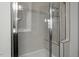 Shower with built-in seat and glass enclosure at 386 Cotton Brook Dr, Fuquay Varina, NC 27526