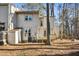 Townhouse exterior with deck and surrounding trees at 445 Pebble Creek Dr, Cary, NC 27511