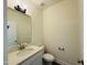 Half-bath with a white vanity, modern mirror, and toilet with a brushed nickel handle at 494 Traditions Grande Blvd # 25, Wake Forest, NC 27587