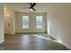 Living room with wood floors, neutral walls, and abundant natural light from the windows at 494 Traditions Grande Blvd # 25, Wake Forest, NC 27587