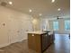 Inviting living room with neutral walls, wood flooring, and abundant natural light at 494 Traditions Grande Blvd # 25, Wake Forest, NC 27587