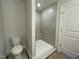 Bathroom featuring tile shower and toilet at 496 Traditions Grande Blvd # 24, Wake Forest, NC 27587