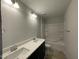 Bathroom featuring double sinks, granite countertop, and tub at 496 Traditions Grande Blvd # 24, Wake Forest, NC 27587