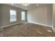 Bright bedroom with large windows offering ample natural light and serene views at 496 Traditions Grande Blvd # 24, Wake Forest, NC 27587