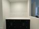 Elegant butler's pantry boasts sleek cabinetry, stylish backsplash, and a functional countertop at 496 Traditions Grande Blvd # 24, Wake Forest, NC 27587