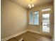 Open dining area with modern chandelier and bright windows offering great views and natural light at 496 Traditions Grande Blvd # 24, Wake Forest, NC 27587