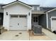 New construction home with attached garage and modern exterior design at 496 Traditions Grande Blvd # 24, Wake Forest, NC 27587