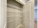 Pantry features adjustable wire shelving, offering flexible storage solutions at 496 Traditions Grande Blvd # 24, Wake Forest, NC 27587