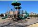 Community playground with swings, slides, and climbing structures for children at 496 Traditions Grande Blvd # 24, Wake Forest, NC 27587