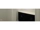 A modern black storage cabinet with a sleek white countertop complements the light, textured wall at 496 Traditions Grande Blvd # 24, Wake Forest, NC 27587