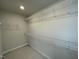Spacious walk-in closet featuring wire shelving for organized storage at 496 Traditions Grande Blvd # 24, Wake Forest, NC 27587