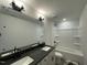 Bathroom features double sinks, modern fixtures, and a bathtub-shower combination at 498 Traditions Grande Blvd # 23, Wake Forest, NC 27587