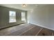 Bright bedroom with dual windows offering plenty of natural light, creating a warm and inviting space at 498 Traditions Grande Blvd # 23, Wake Forest, NC 27587