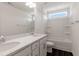 Bright bathroom featuring a double vanity with granite countertop and a shower-tub combo at 500 Traditions Grande Blvd # 22, Wake Forest, NC 27587