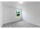 Bedroom with neutral carpet, base molding and natural light at 500 Traditions Grande Blvd # 22, Wake Forest, NC 27587