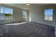Spacious bedroom with plush carpet and large windows filling the room with natural light at 500 Traditions Grande Blvd # 22, Wake Forest, NC 27587