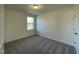Bedroom with neutral carpet, window for natural light and a closet at 500 Traditions Grande Blvd # 22, Wake Forest, NC 27587