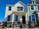 Charming two-story home with black fence and stone foundation, offering curb appeal at 500 Traditions Grande Blvd # 22, Wake Forest, NC 27587
