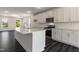 Bright, spacious kitchen features white cabinets, stainless appliances, and granite countertops at 500 Traditions Grande Blvd # 22, Wake Forest, NC 27587