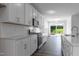 Spacious kitchen with white cabinets, stainless steel appliances, and an open flow at 500 Traditions Grande Blvd # 22, Wake Forest, NC 27587