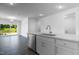 Open-concept kitchen features granite countertops and stainless steel dishwasher at 500 Traditions Grande Blvd # 22, Wake Forest, NC 27587