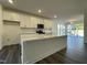 Kitchen featuring granite island, stainless steel appliances, and open concept design at 500 Traditions Grande Blvd # 22, Wake Forest, NC 27587