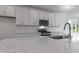 Modern kitchen with stainless steel appliances, granite counters, and white subway tile backsplash at 500 Traditions Grande Blvd # 22, Wake Forest, NC 27587