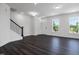 Open-concept living area with hardwood floors and an abundance of natural light at 500 Traditions Grande Blvd # 22, Wake Forest, NC 27587
