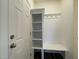 View of the mudroom featuring storage shelves, coat hooks and bench seating at 500 Traditions Grande Blvd # 22, Wake Forest, NC 27587