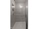 Neutral colored tiled shower with a built-in bench seat at 500 Traditions Grande Blvd # 22, Wake Forest, NC 27587
