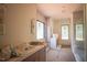This sleek bathroom features a double vanity, a spacious shower, and lots of natural light at 7013 Buckhead Dr, Raleigh, NC 27615