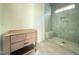 Bathroom featuring a modern vanity and shower stall with tiled walls at 7013 Buckhead Dr, Raleigh, NC 27615