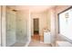 Bright bathroom with marble tile, glass shower, and updated fixtures offers a spa-like experience at 7013 Buckhead Dr, Raleigh, NC 27615