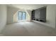 Unfinished bedroom featuring a built in entertainment center and a large window at 7013 Buckhead Dr, Raleigh, NC 27615