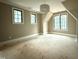 Spacious bedroom with multiple windows, and overhead lighting fixture at 7013 Buckhead Dr, Raleigh, NC 27615