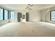 Spacious bedroom featuring large windows providing natural light and double doors to another room at 7013 Buckhead Dr, Raleigh, NC 27615