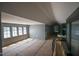 A neutral-colored bedroom features large windows and architectural ceiling at 7013 Buckhead Dr, Raleigh, NC 27615