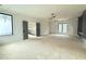 Open bedroom with a view of a staircase, complemented by modern lighting and ample natural light at 7013 Buckhead Dr, Raleigh, NC 27615