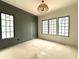 Bedroom featuring a large window and designer lighting at 7013 Buckhead Dr, Raleigh, NC 27615