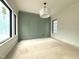Bedroom featuring arched wall design and black trim windows at 7013 Buckhead Dr, Raleigh, NC 27615