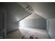 Slanted gray bedroom with architectural ceiling and chandelier at 7013 Buckhead Dr, Raleigh, NC 27615